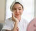attractive-asian-woman-bathrobe-cleaning-her-face-with-cleansing-oil-applying-moisturizer